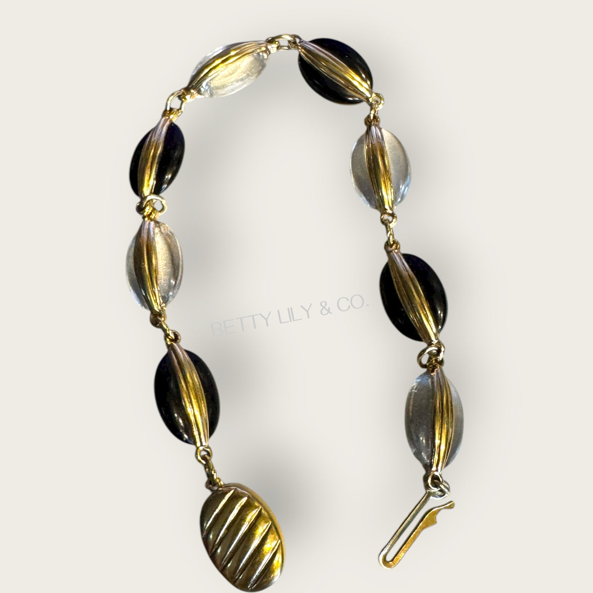 Vintage Swarovski Dove-Marked Crystal Cabochon Bracelet – Jet & Clear, Ribbed Gold Wrap Links
