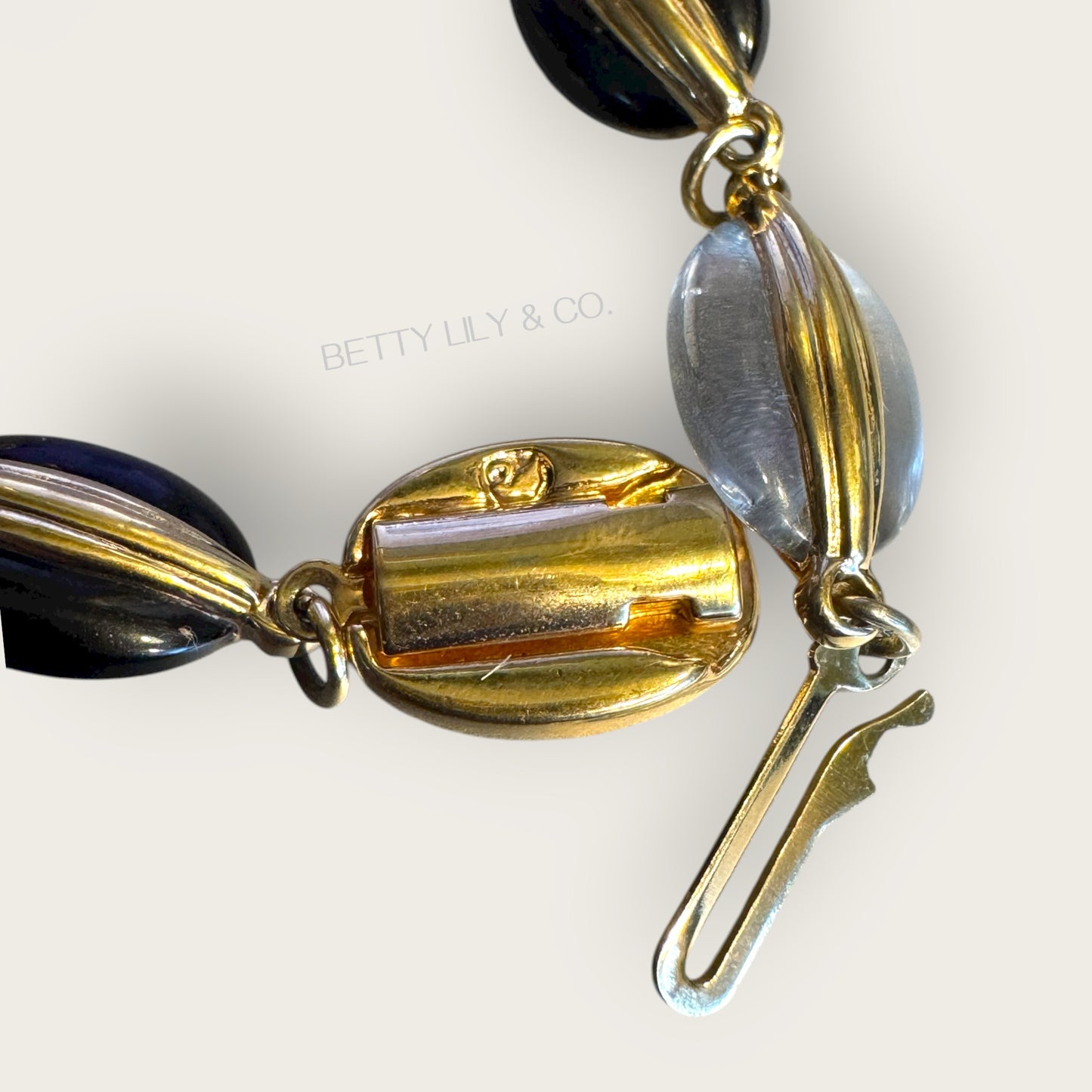 Vintage Swarovski Dove-Marked Crystal Cabochon Bracelet – Jet & Clear, Ribbed Gold Wrap Links