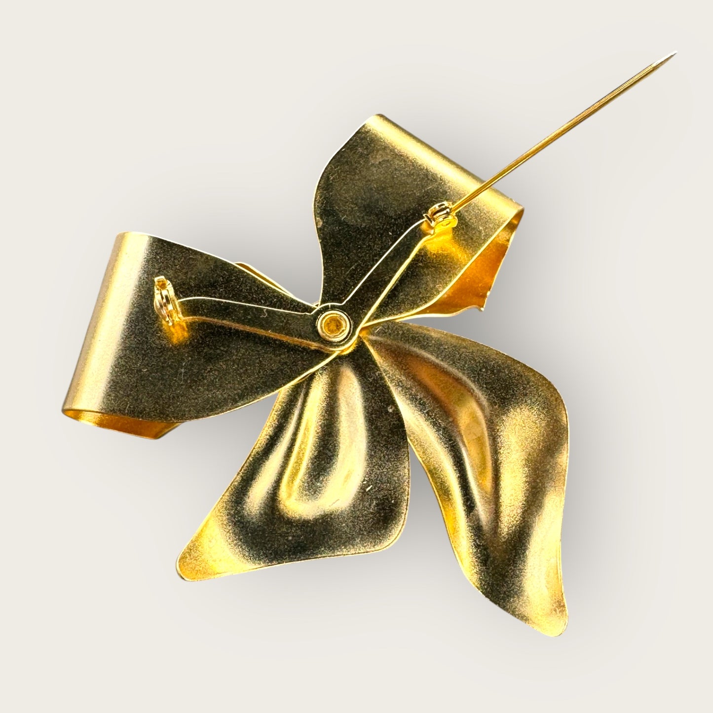 Vintage Gold-Tone Bow Brooch with Clear Rhinestones – Unsigned