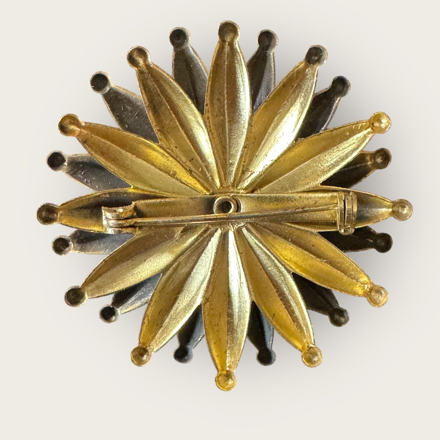 Mid-Century Layered Brass Sunburst Brooch with Green Glass Cabochon – Atomic Modernist Design
