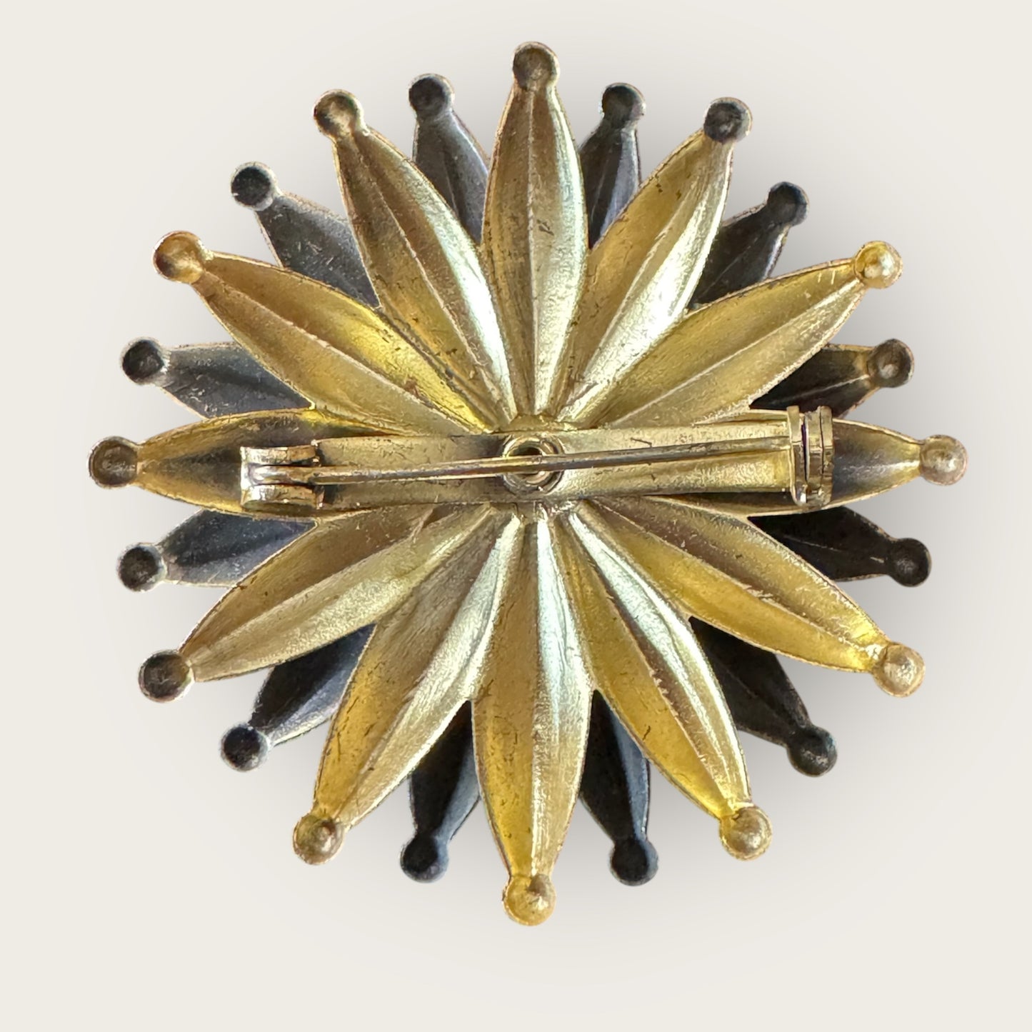 Mid-Century Layered Brass Sunburst Brooch with Green Glass Cabochon – Atomic Modernist Design