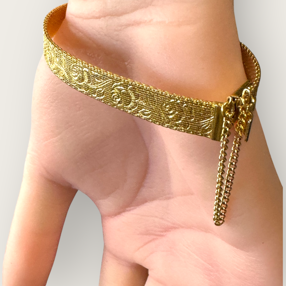 Vintage 1950s Monet Gold-Tone Rose Embossed Bracelet with Safety Chain – Signed Mid-Century Elegance