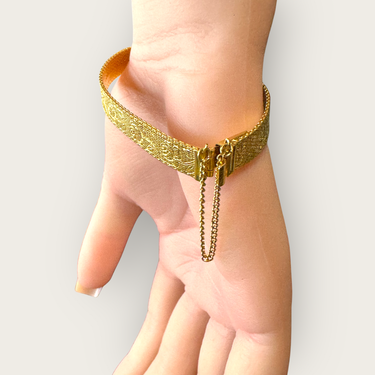 Vintage 1950s Monet Gold-Tone Rose Embossed Bracelet with Safety Chain – Signed Mid-Century Elegance