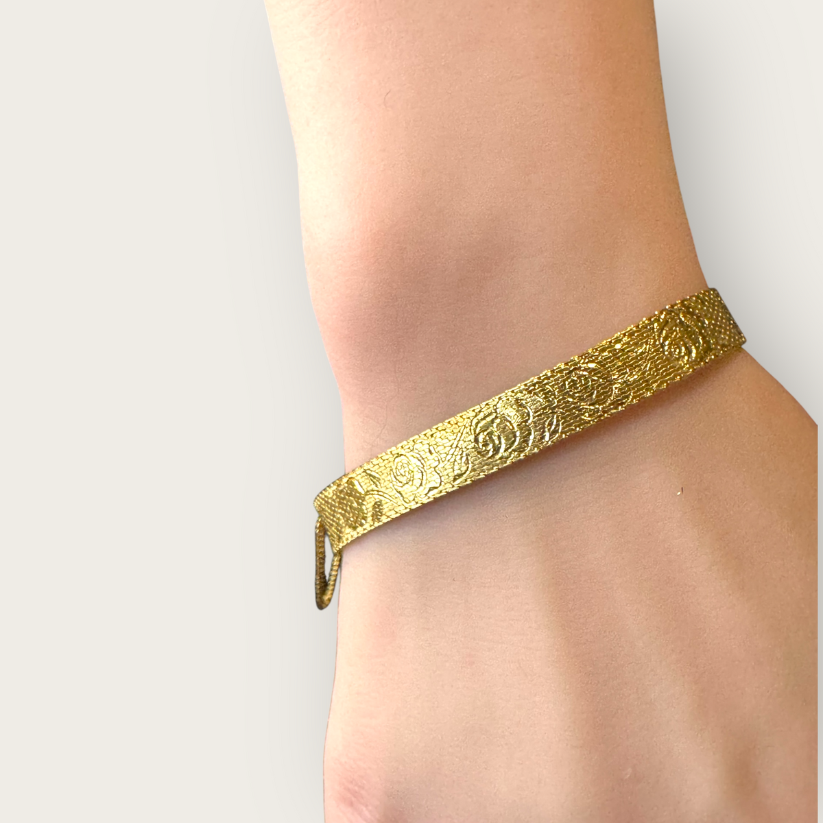 Vintage 1950s Monet Gold-Tone Rose Embossed Bracelet with Safety Chain – Signed Mid-Century Elegance