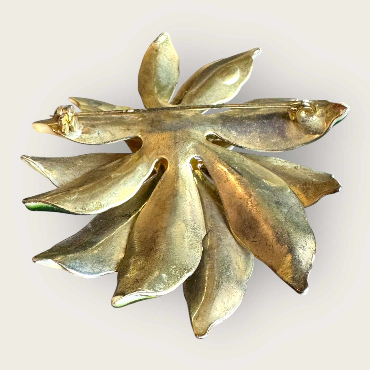 Vintage white poinsettia enamel brooch with green leaves and topaz rhinestone center – 1 inch holiday flower pin