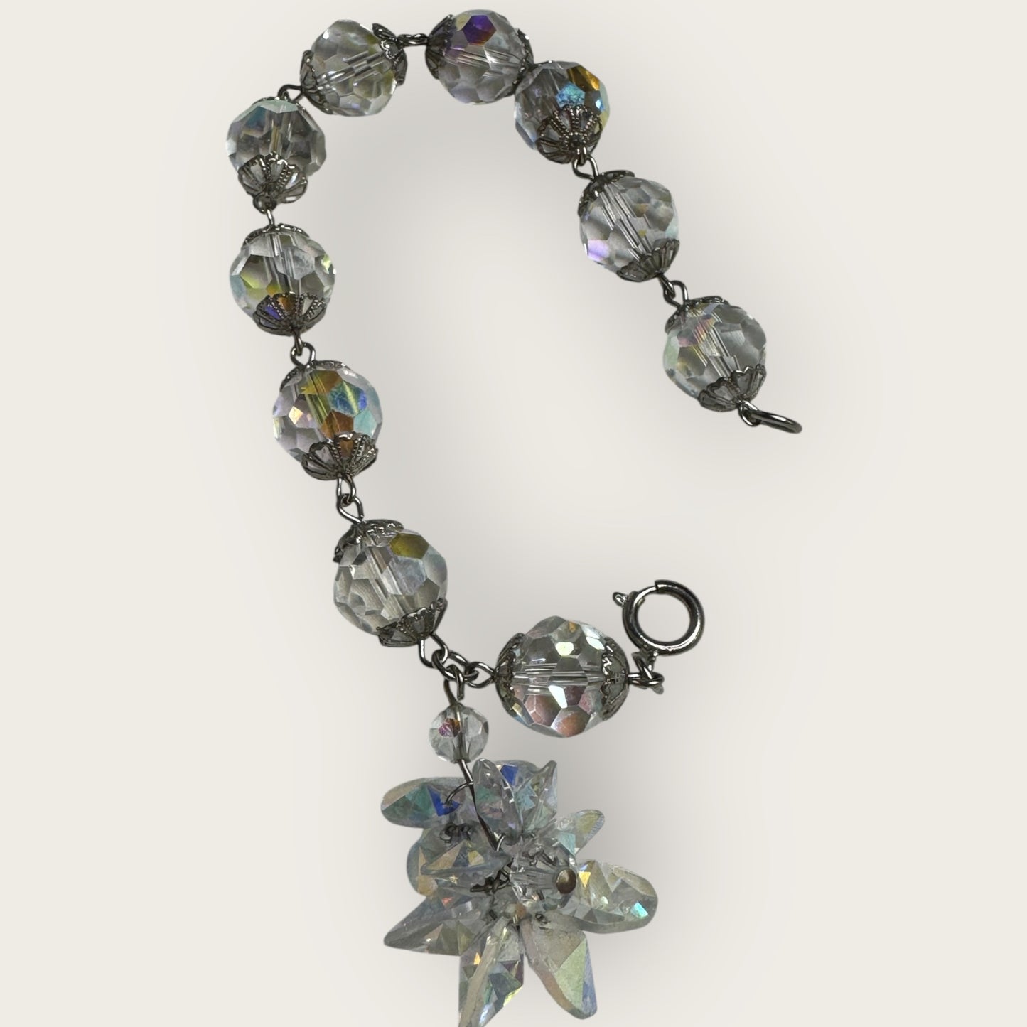 Vintage aurora borealis crystal bracelet with silver filigree spacers and dangle, 1950s