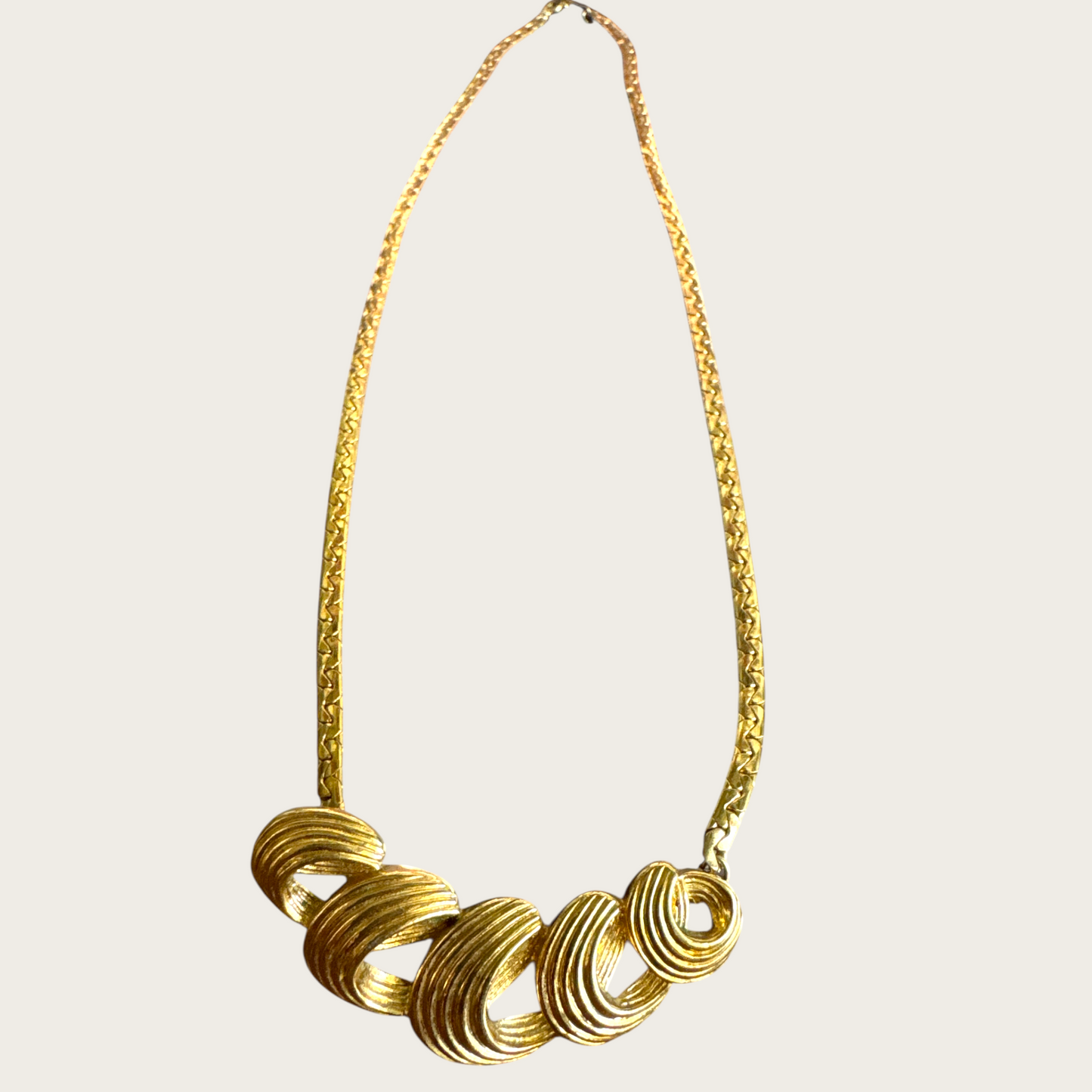 Vintage Monet Gold-Tone Swirl Bar Necklace – 1980s Statement Jewelry