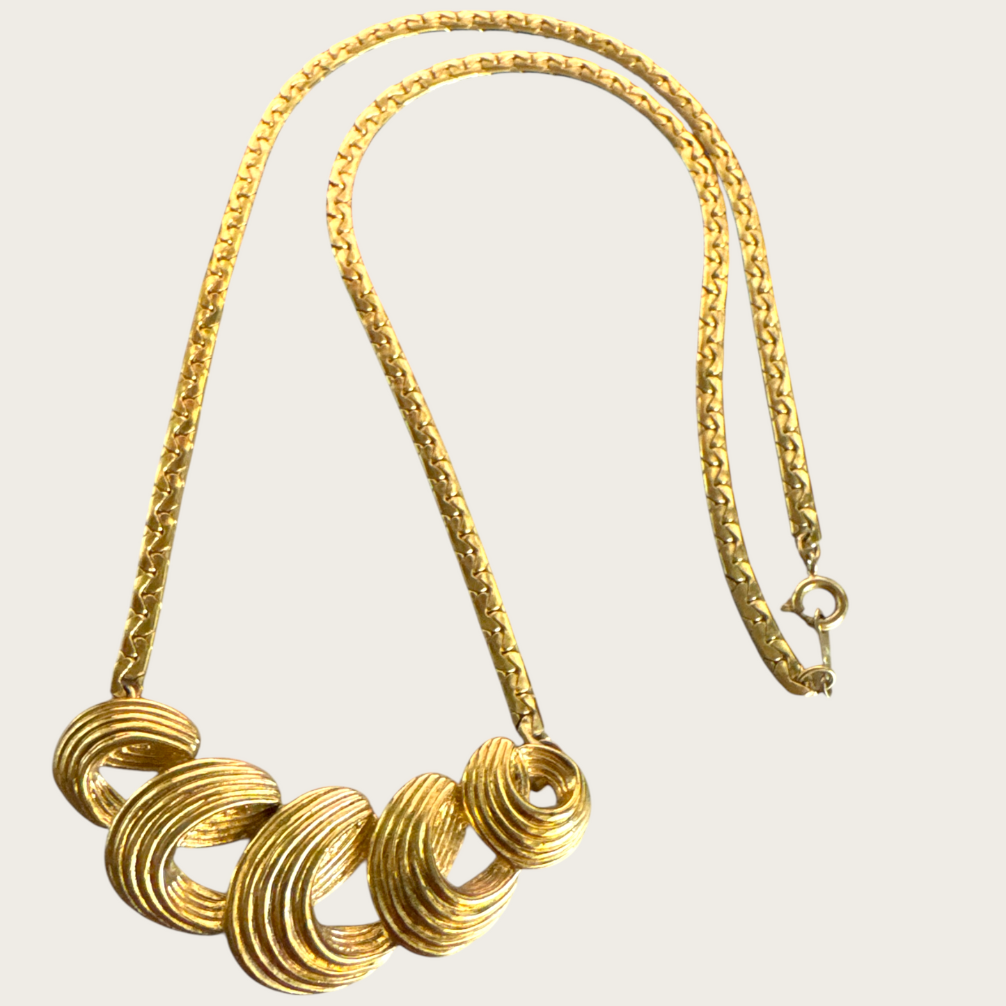 Vintage Monet Gold-Tone Swirl Bar Necklace – 1980s Statement Jewelry