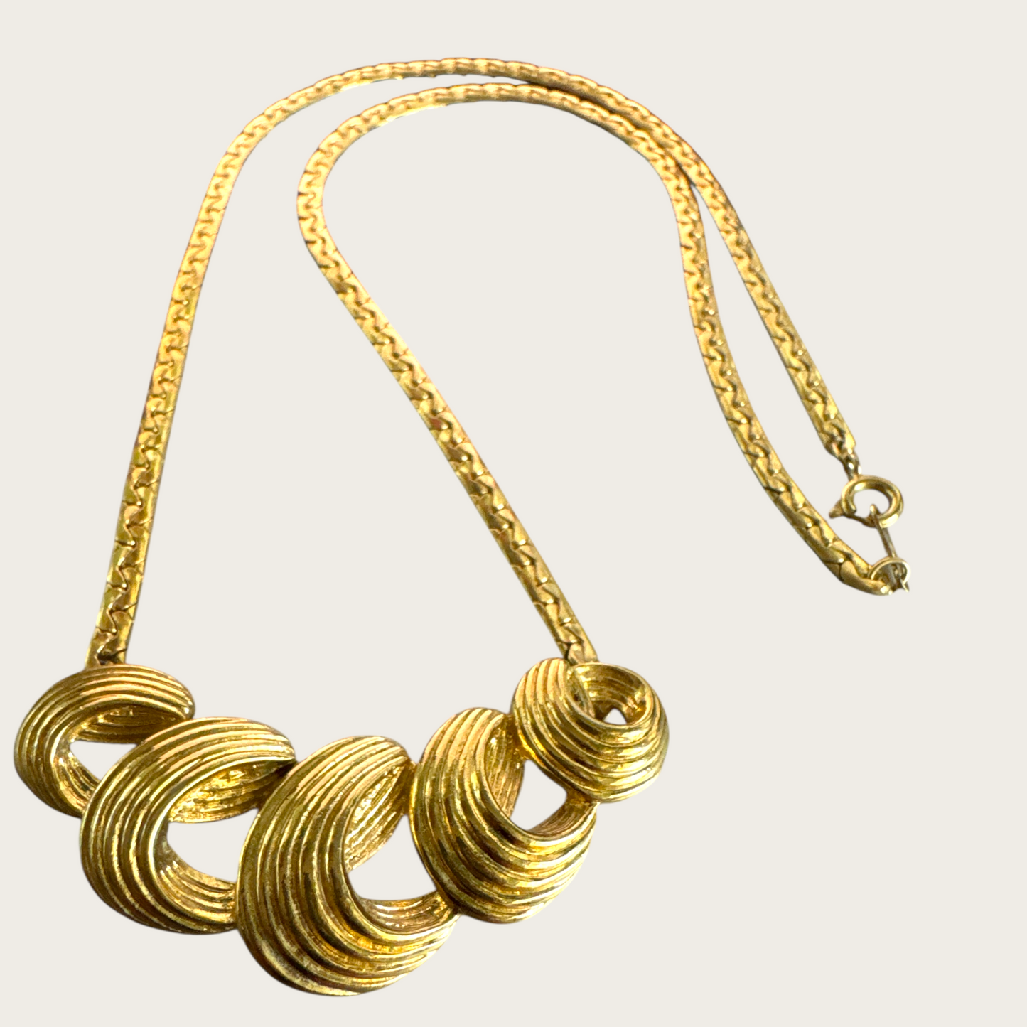 Vintage Monet Gold-Tone Swirl Bar Necklace – 1980s Statement Jewelry