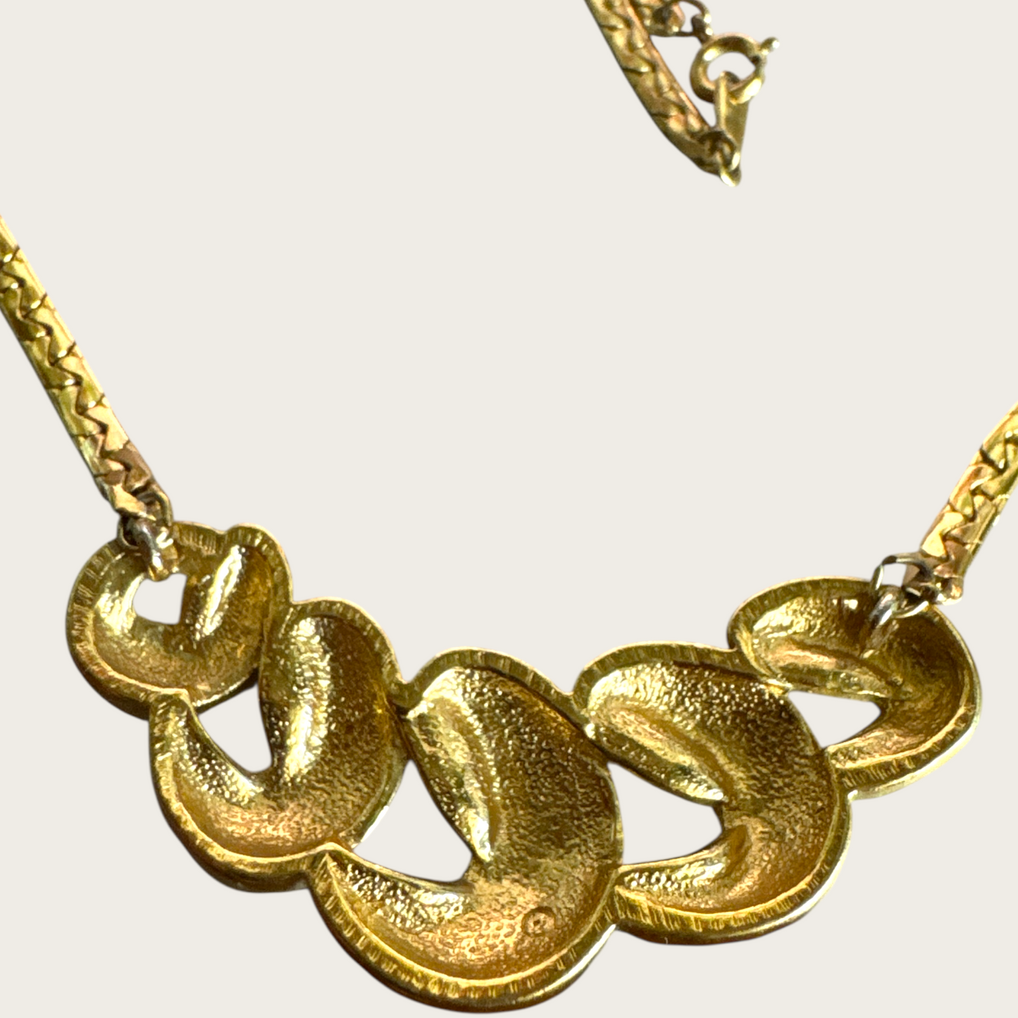 Vintage Monet Gold-Tone Swirl Bar Necklace – 1980s Statement Jewelry