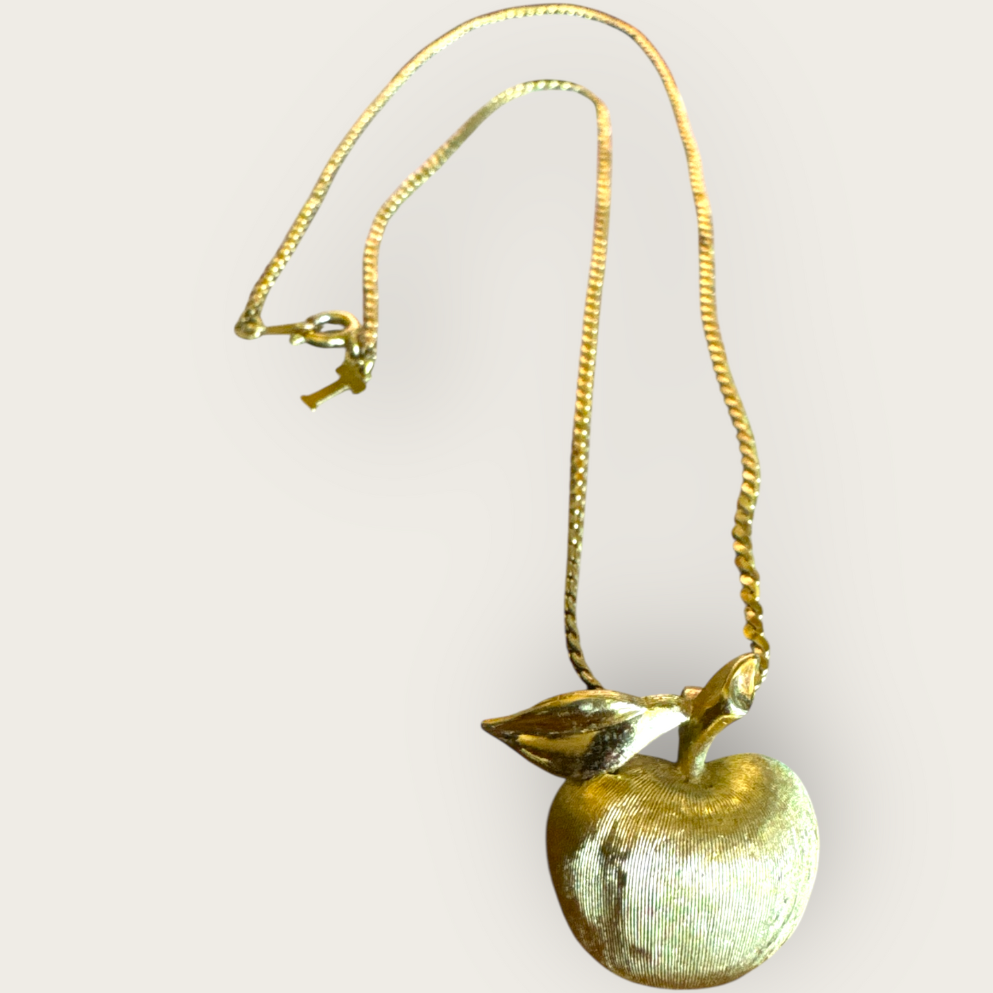 Crown Trifari Signed Petite Gold Tone Apple Pendant Necklace with Textured Finish