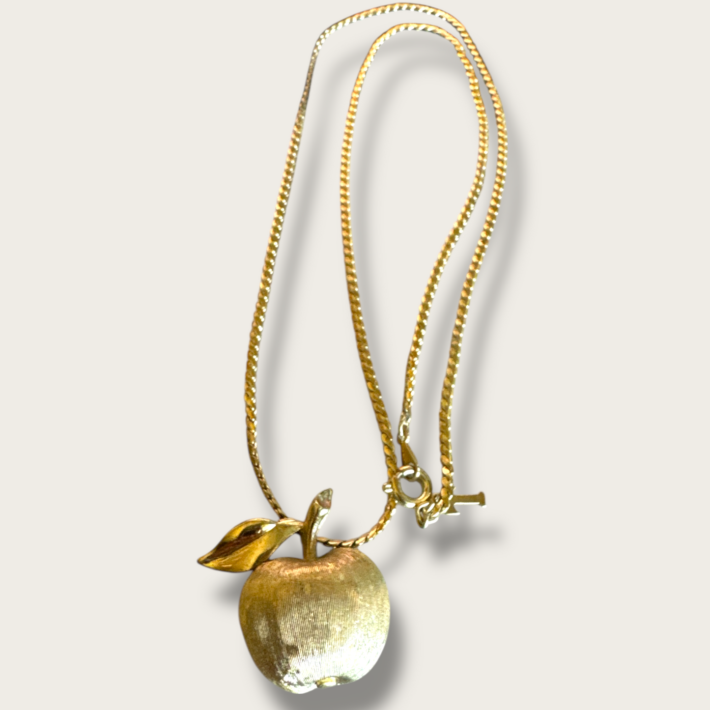 Crown Trifari Signed Petite Gold Tone Apple Pendant Necklace with Textured Finish