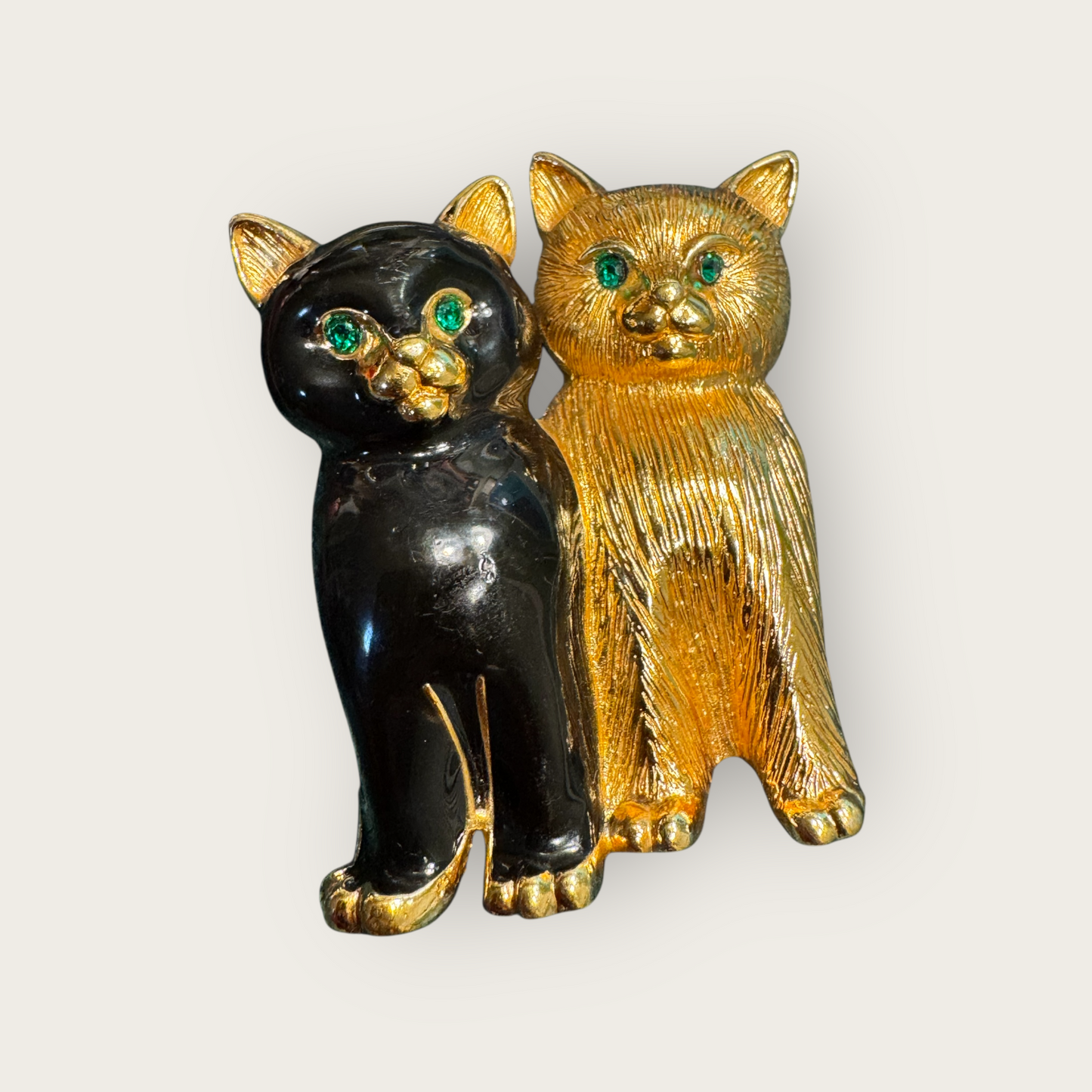 Vintage Swarovski Dual Cats Brooch – Black Enamel & Brushed Gold Tone with Emerald Crystal Eyes (c. 1980s–1990s)
