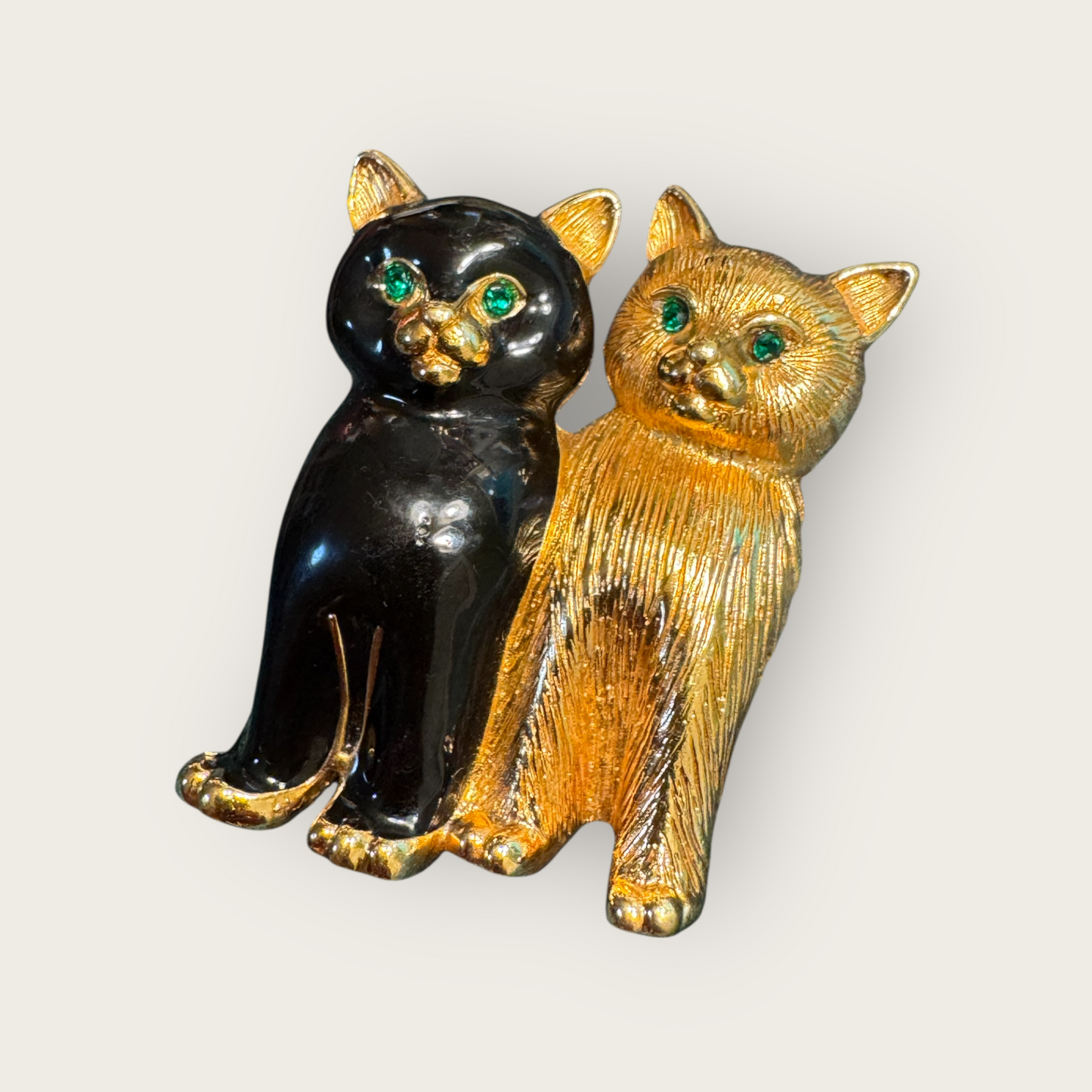 Vintage Swarovski Dual Cats Brooch – Black Enamel & Brushed Gold Tone with Emerald Crystal Eyes (c. 1980s–1990s)