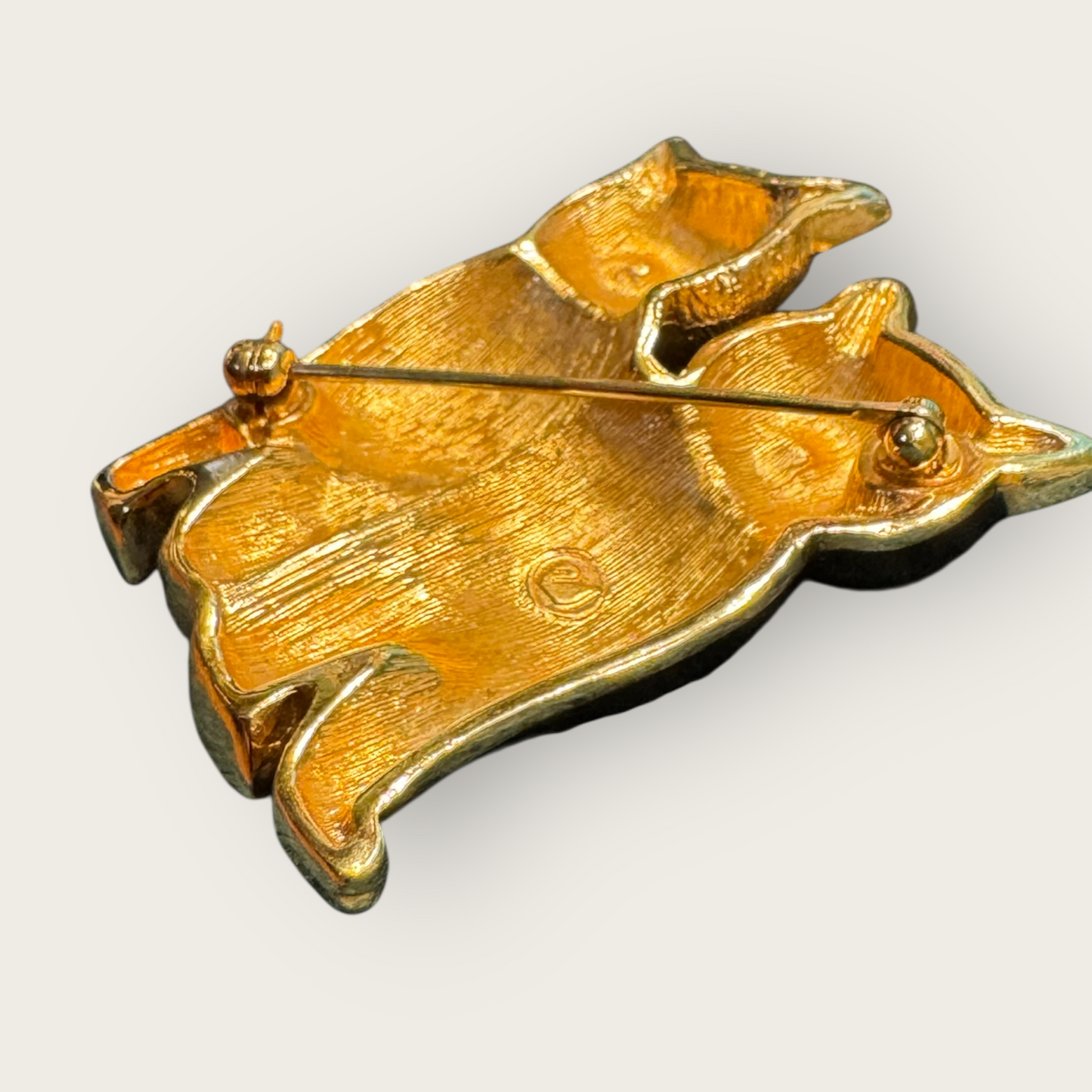 Vintage Swarovski Dual Cats Brooch – Black Enamel & Brushed Gold Tone with Emerald Crystal Eyes (c. 1980s–1990s)