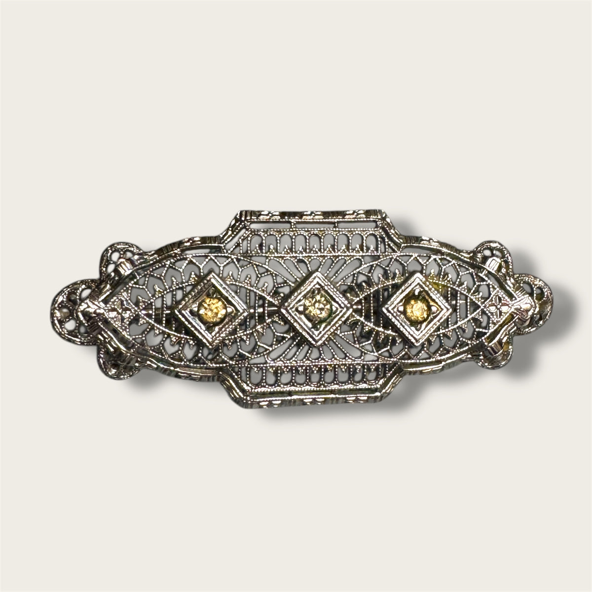 Vintage Silver-Tone Geometric Filigree Brooch with Champagne Rhinestones