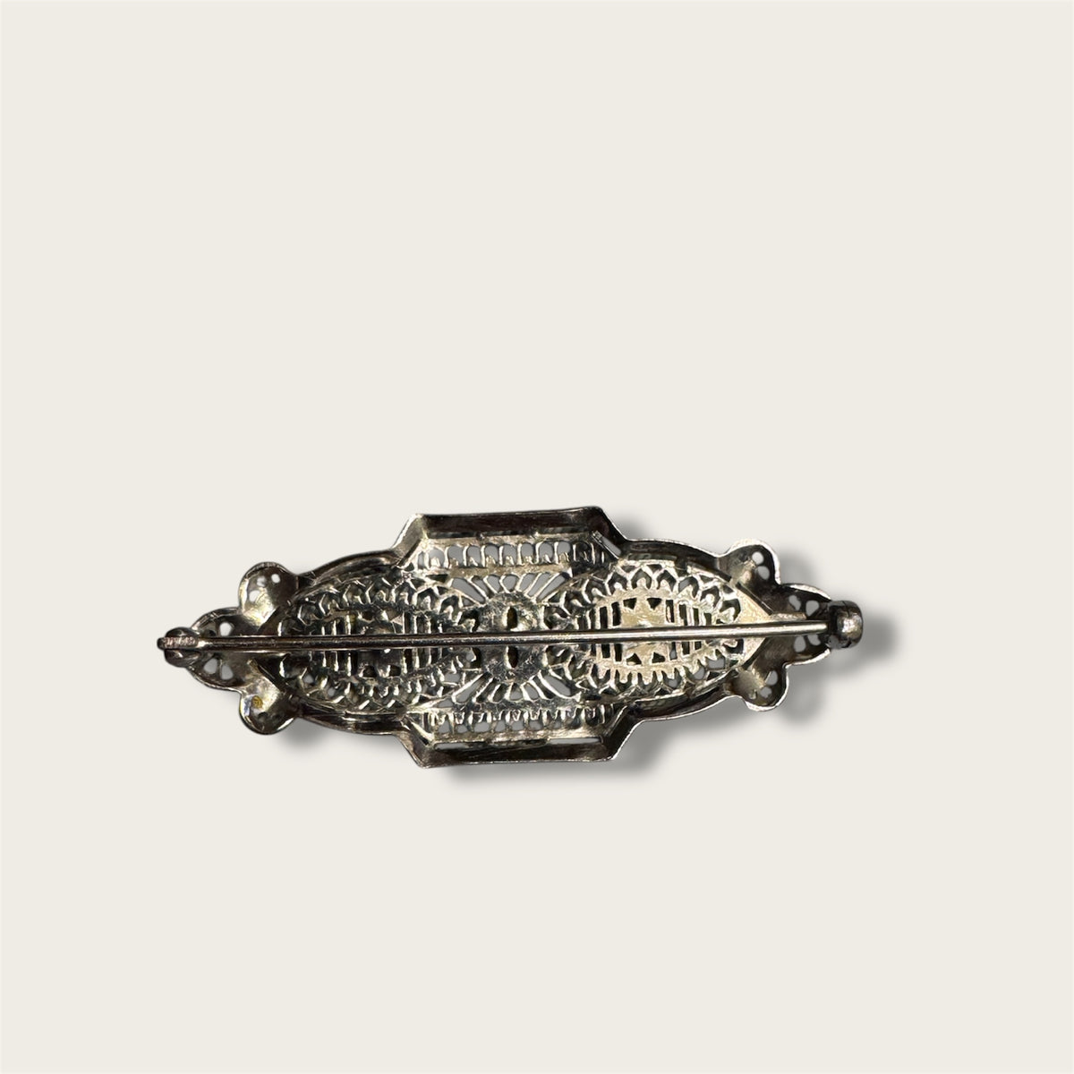 Vintage Silver-Tone Geometric Filigree Brooch with Champagne Rhinestones