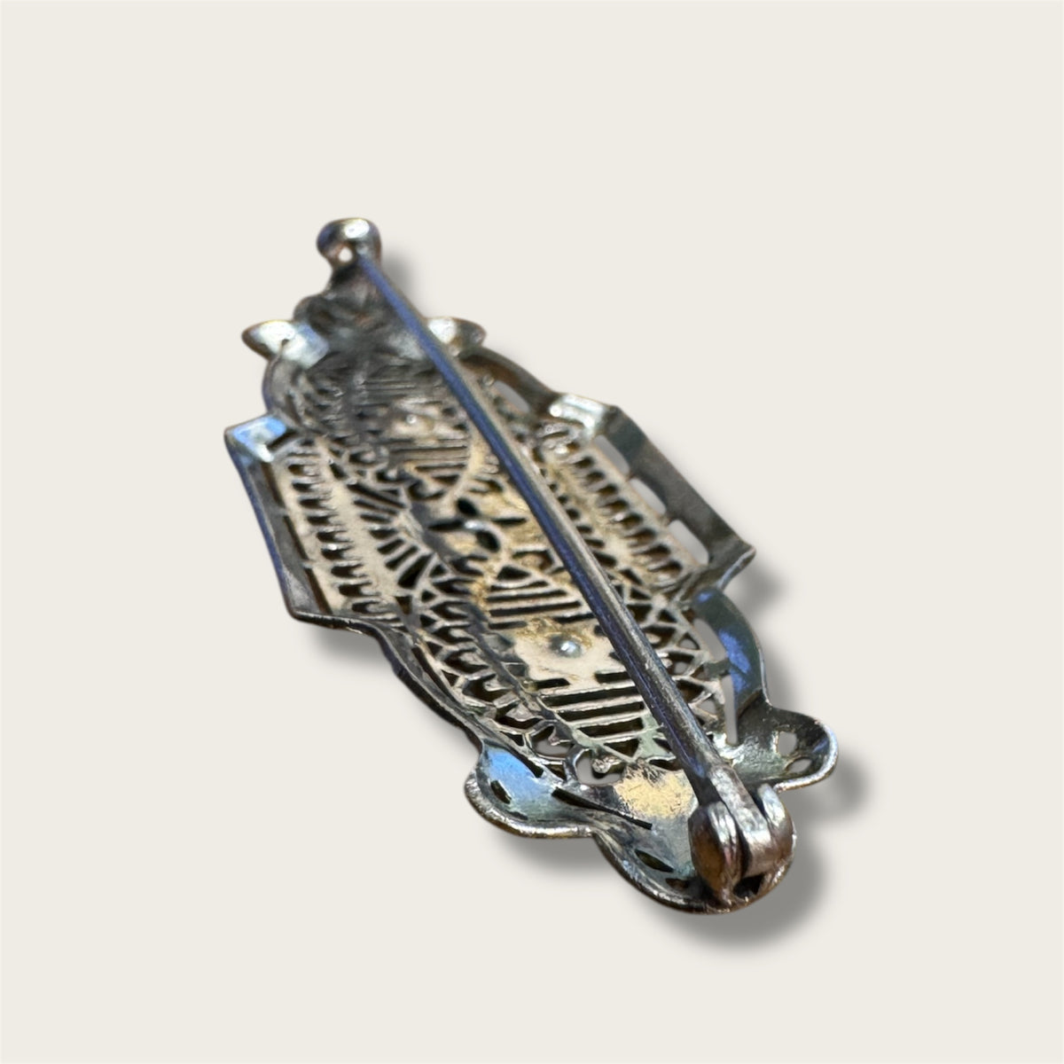 Vintage Silver-Tone Geometric Filigree Brooch with Champagne Rhinestones