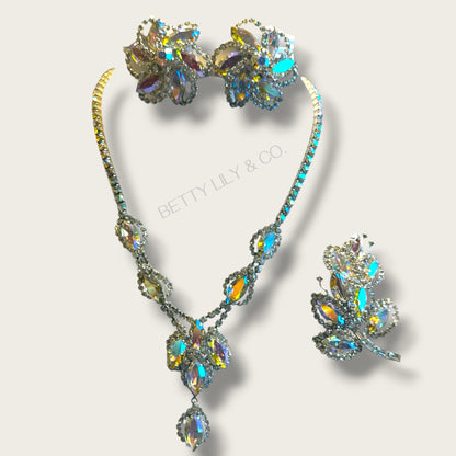 Vintage Weiss Aurora Borealis Four-Piece Parure – Necklace, Clip Earrings & Dual Brooch Set – Mid-Century AB Navette & Rivoli – Signed