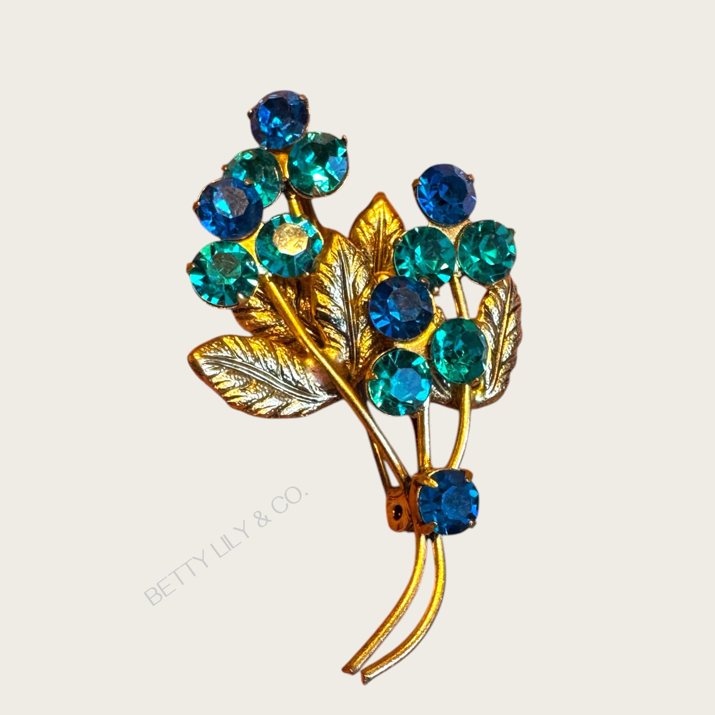 Vintage Austrian-Style Blue & Teal Rhinestone Floral Brooch – Mid-Century Bouquet Pin, Gold-Tone, 1950s–60s