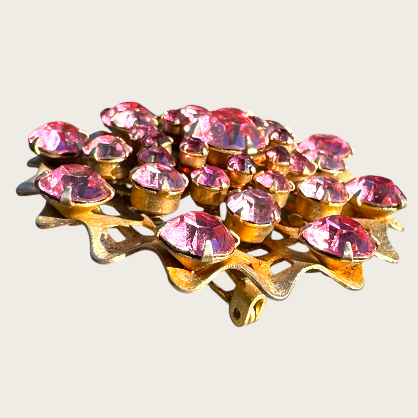 Vintage Mid-Century Pink Rhinestone Domed Starburst Brooch – Layered Openwork Gold Tone