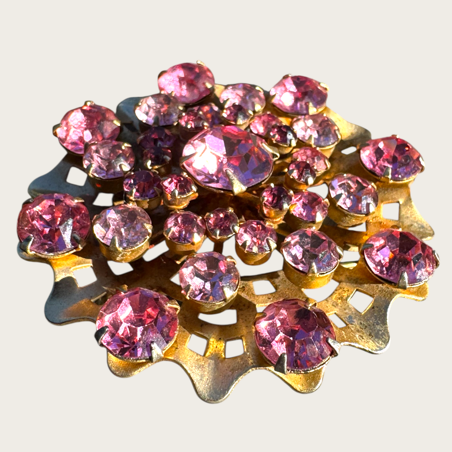 Vintage Mid-Century Pink Rhinestone Domed Starburst Brooch – Layered Openwork Gold Tone