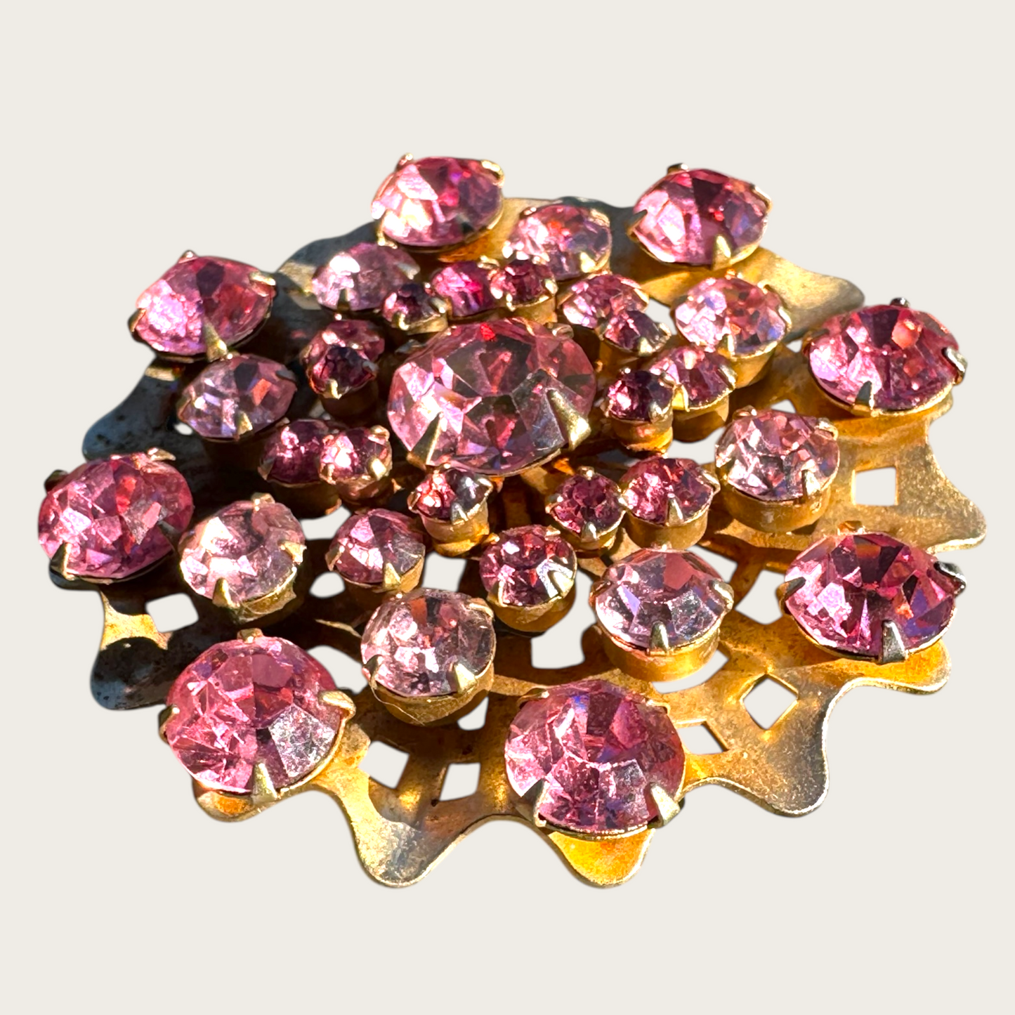 Vintage Mid-Century Pink Rhinestone Domed Starburst Brooch – Layered Openwork Gold Tone