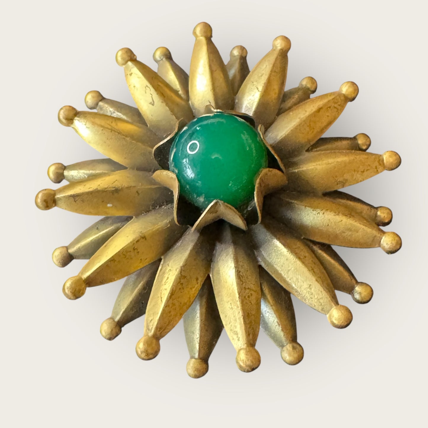 Mid-Century Layered Brass Sunburst Brooch with Green Glass Cabochon – Atomic Modernist Design