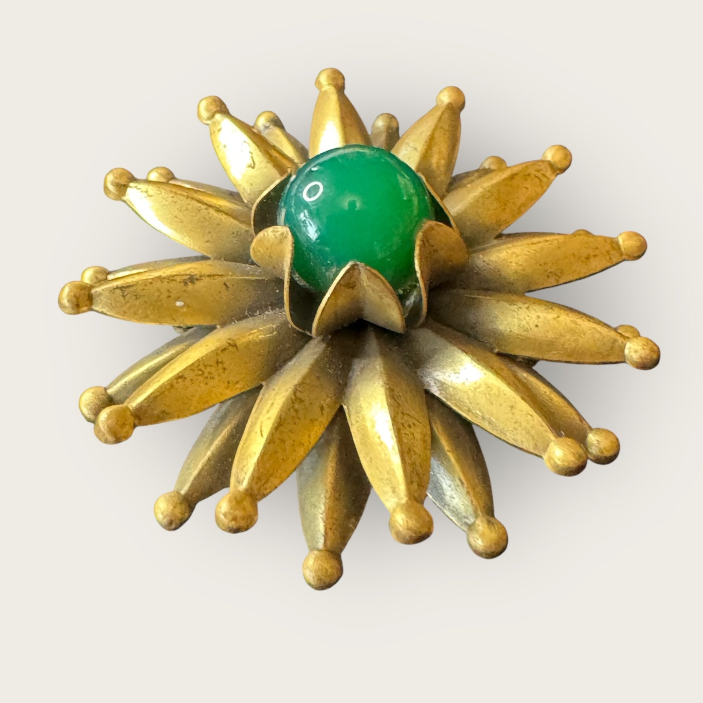 Mid-Century Layered Brass Sunburst Brooch with Green Glass Cabochon – Atomic Modernist Design