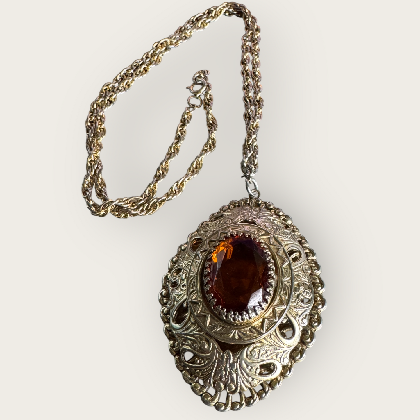 Vintage 1970s Gold-Tone Statement Pendant Necklace – Ornate Embossed Setting with Amber Glass Stone