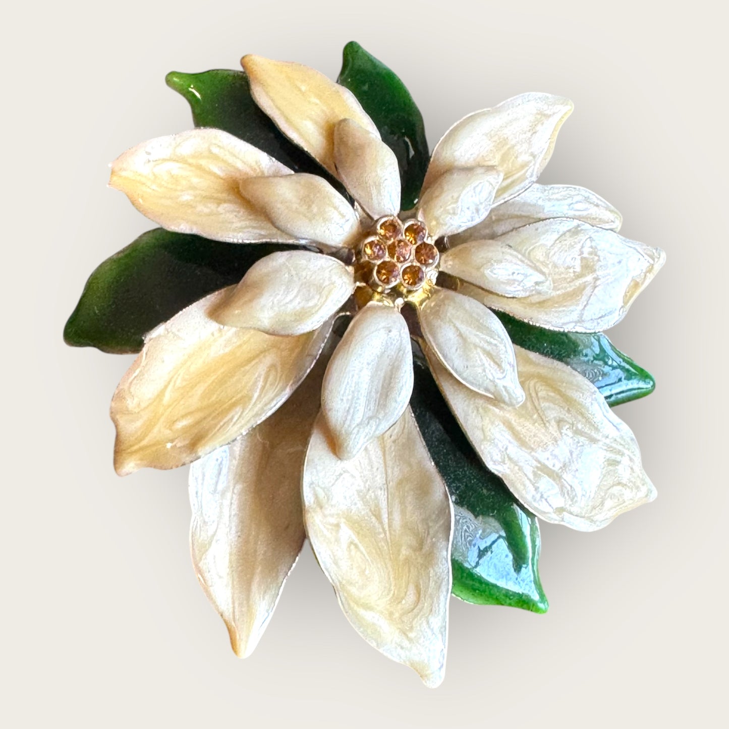 Vintage white poinsettia enamel brooch with green leaves and topaz rhinestone center – 1 inch holiday flower pin