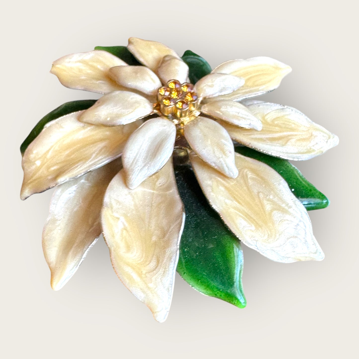 Vintage white poinsettia enamel brooch with green leaves and topaz rhinestone center – 1 inch holiday flower pin