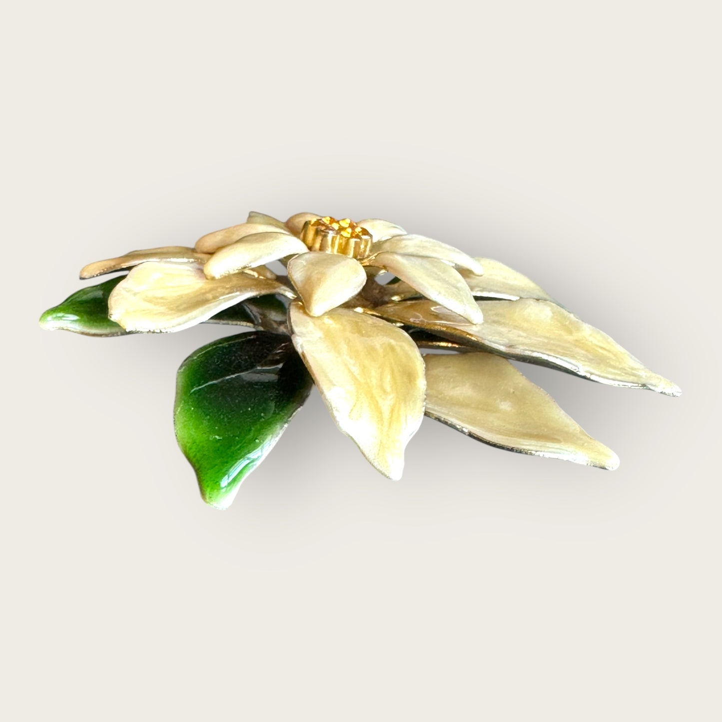 Vintage white poinsettia enamel brooch with green leaves and topaz rhinestone center – 1 inch holiday flower pin