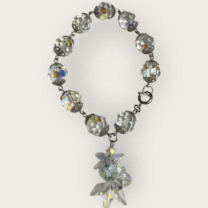 Vintage aurora borealis crystal bracelet with silver filigree spacers and dangle, 1950s