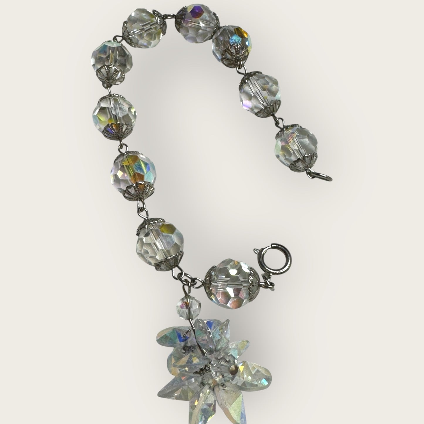 Vintage aurora borealis crystal bracelet with silver filigree spacers and dangle, 1950s