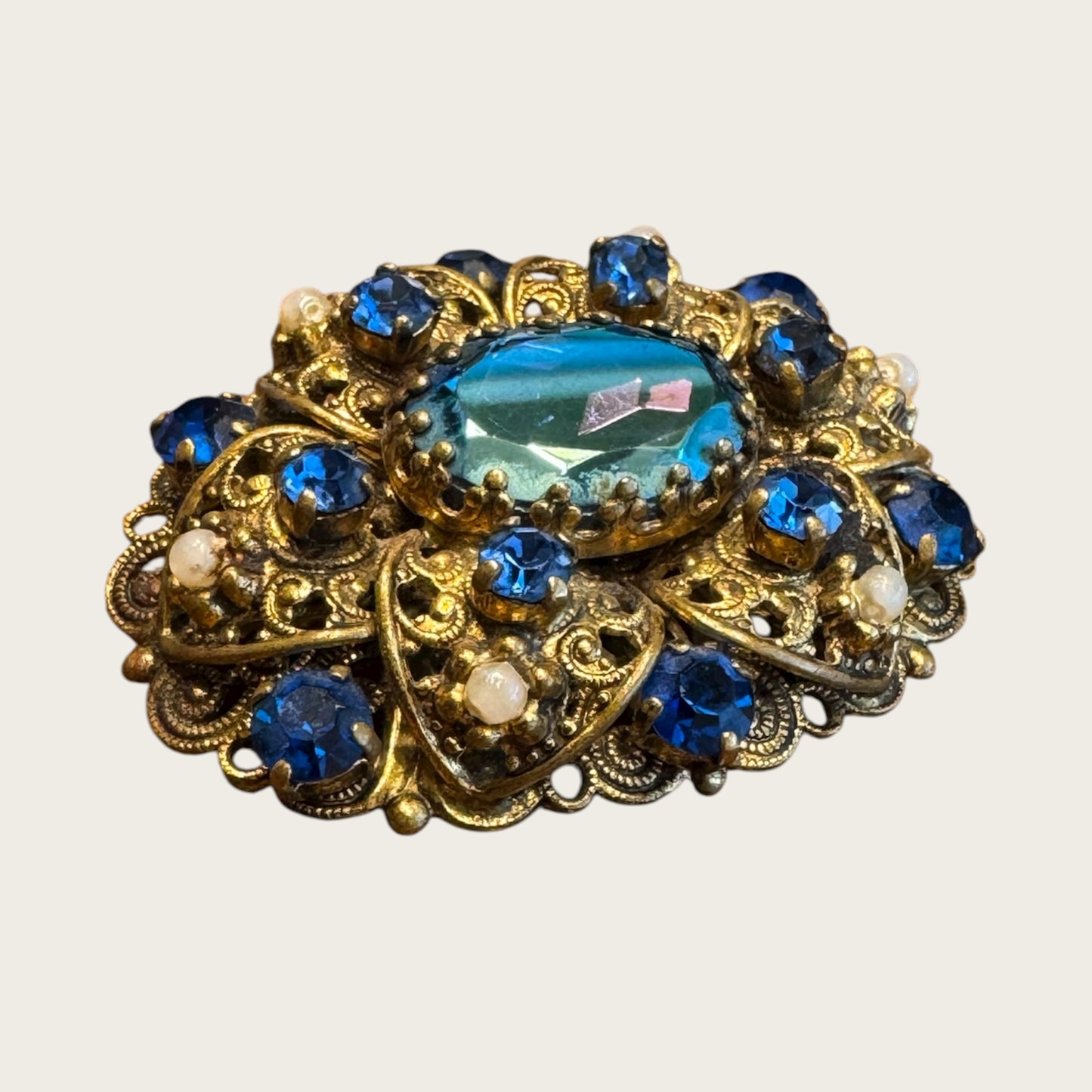 Vintage 1930s Germany Brass Filigree Brooch with Blue Rhinestones and Faux Pearls – Ornate Pre-War Pin