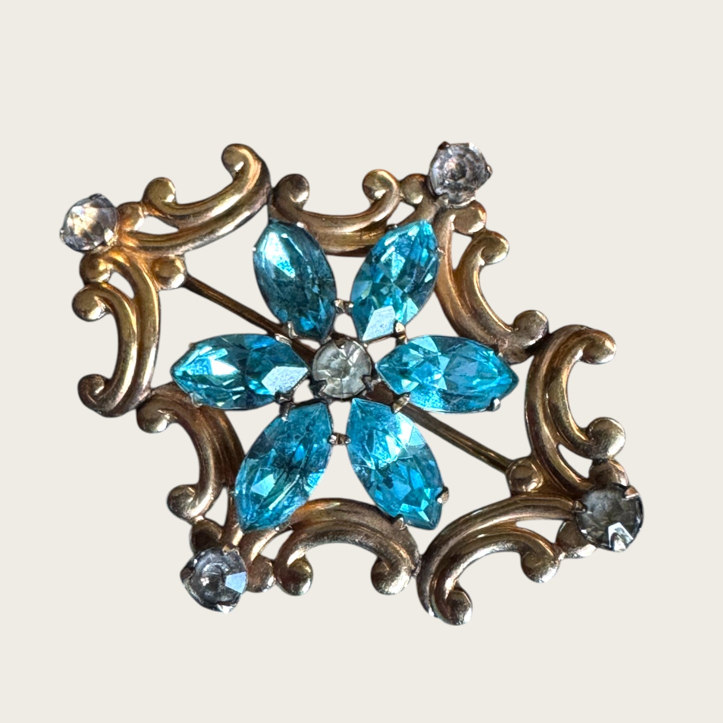 Vintage Simmons Blue Rhinestone Scroll Brooch-Pendant – 1940s Floral Motif in Gold Tone