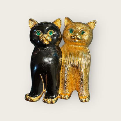 Vintage Swarovski Dual Cats Brooch – Black Enamel & Brushed Gold Tone with Emerald Crystal Eyes (c. 1980s–1990s)