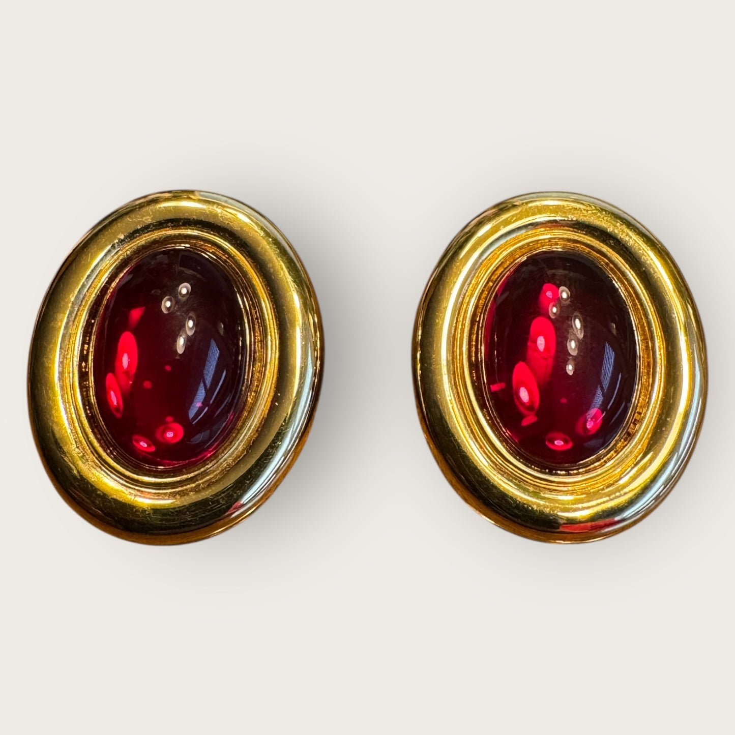 Vintage Monet Oval Glass Cabochon Clip-On Earrings – Ruby Red Cabochon, High-Polish Gold Tone