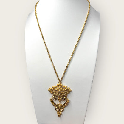 Vintage 1975 Monet “Felice” Statement Pendant Necklace – Gold-Tone Textured Scrollwork | Book Piece