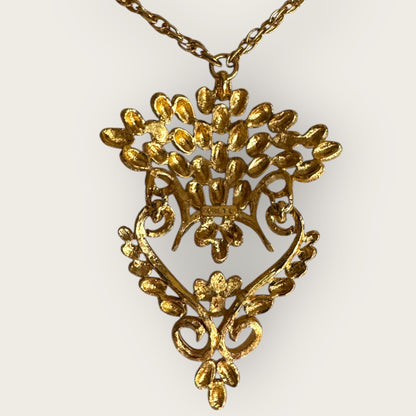 Vintage 1975 Monet “Felice” Statement Pendant Necklace – Gold-Tone Textured Scrollwork | Book Piece