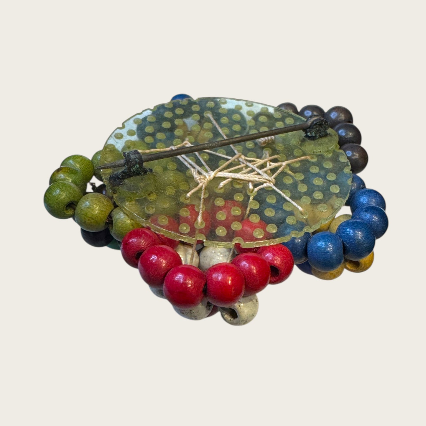 Antique 1930s Wooden Bead Floral Brooch – Hand-Woven Folk Art on Early Plastic Plate (Unsigned)Antique 1930s Wooden Bead Floral Brooch – Hand-Woven Folk Art on Early Plastic Plate (Unsigned)