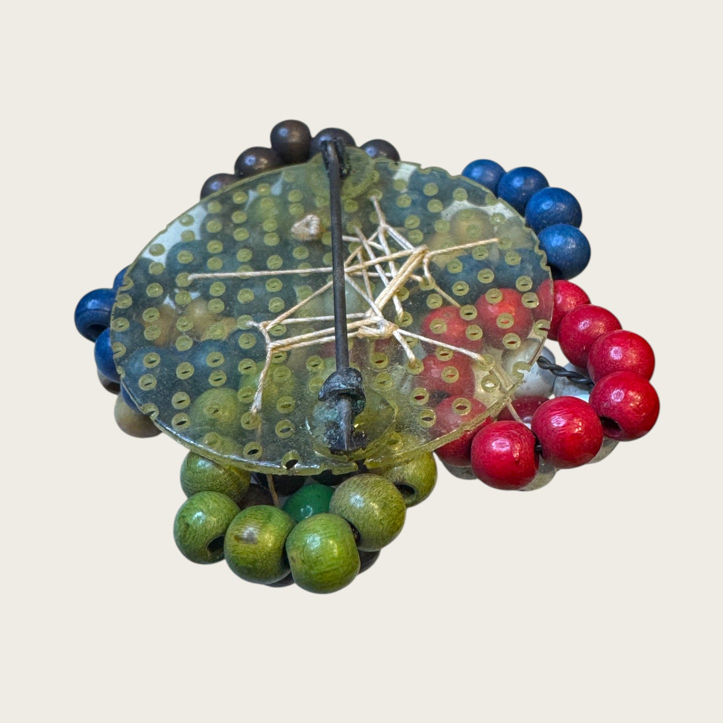 Antique 1930s Wooden Bead Floral Brooch – Hand-Woven Folk Art on Early Plastic Plate (Unsigned)Antique 1930s Wooden Bead Floral Brooch – Hand-Woven Folk Art on Early Plastic Plate (Unsigned)
