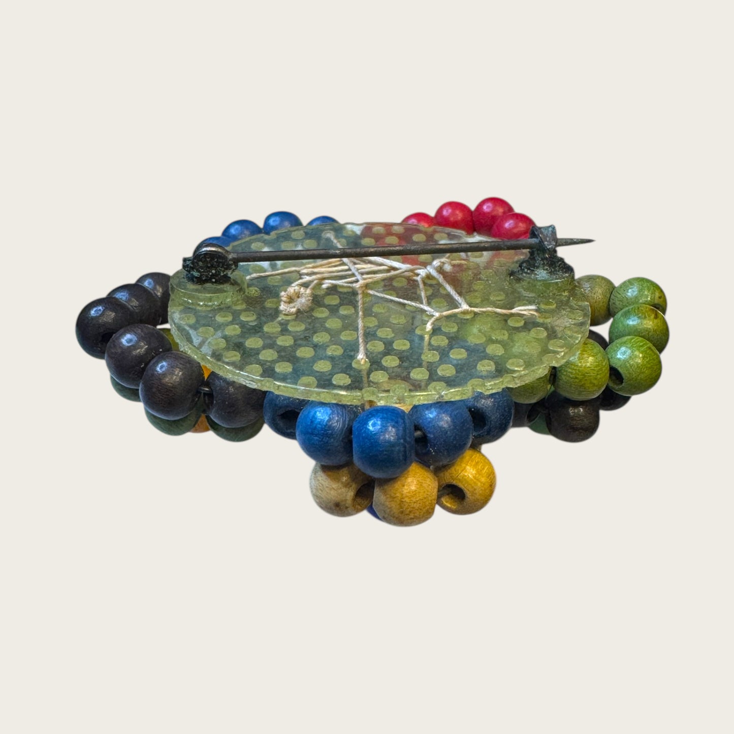 Antique 1930s Wooden Bead Floral Brooch – Hand-Woven Folk Art on Early Plastic Plate (Unsigned)Antique 1930s Wooden Bead Floral Brooch – Hand-Woven Folk Art on Early Plastic Plate (Unsigned)