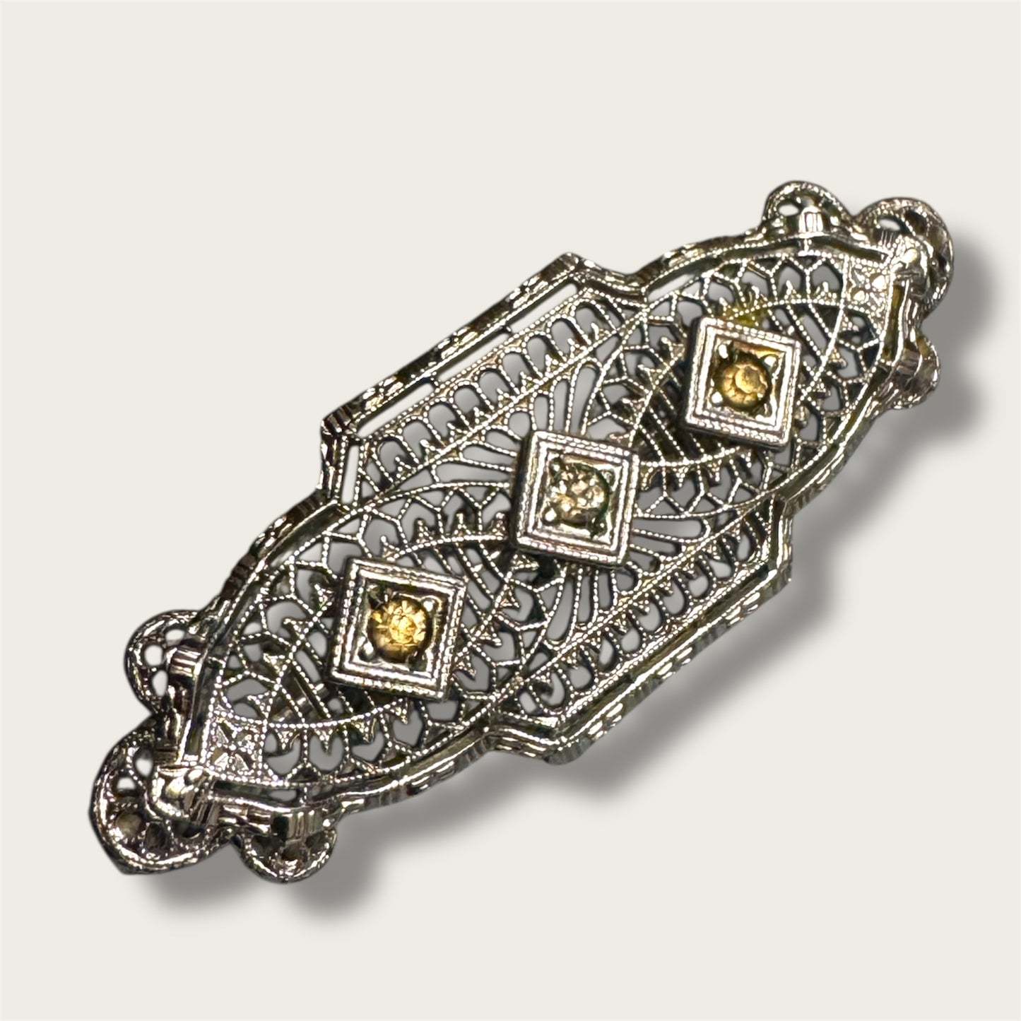 Vintage Silver-Tone Geometric Filigree Brooch with Champagne Rhinestones