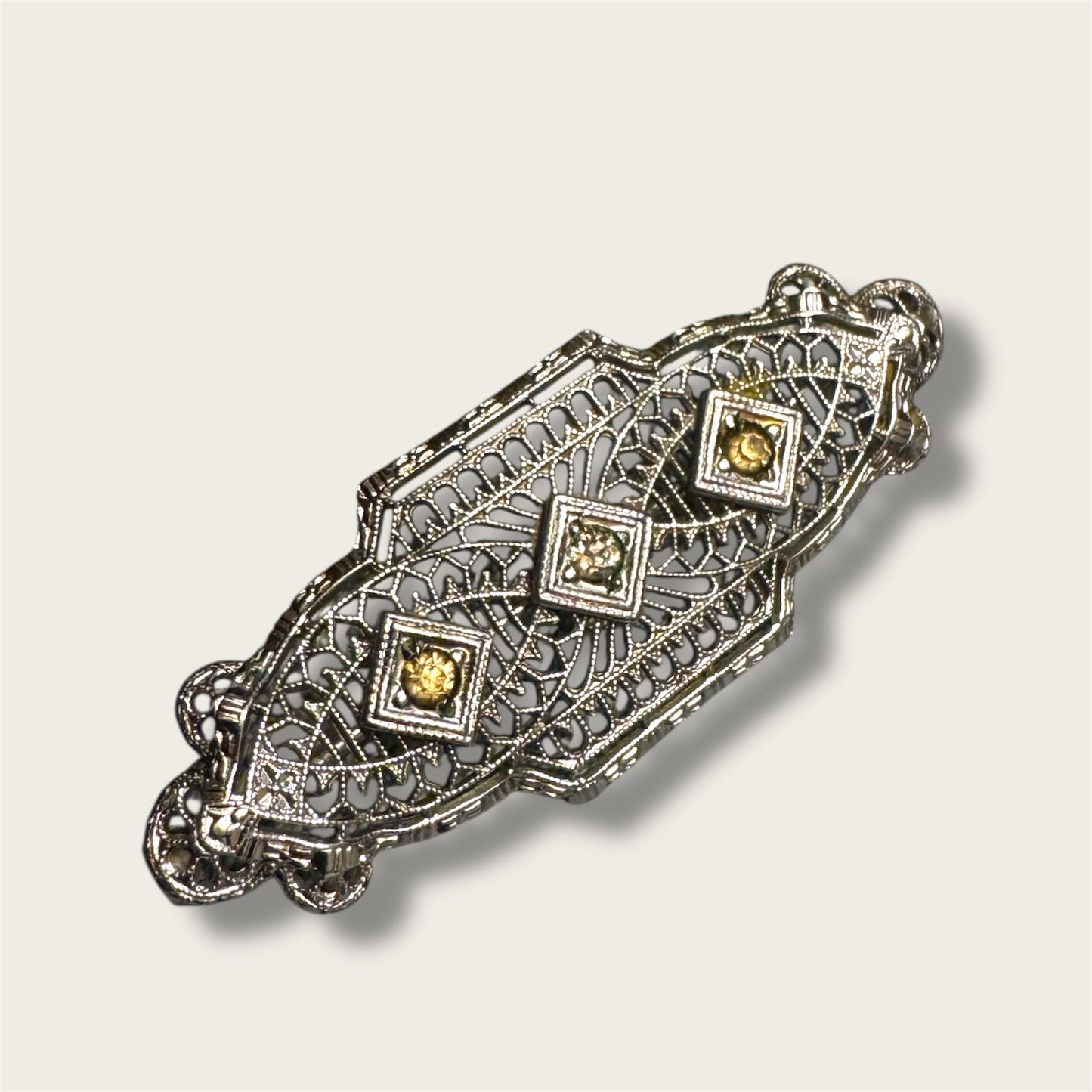 Vintage Silver-Tone Geometric Filigree Brooch with Champagne Rhinestones