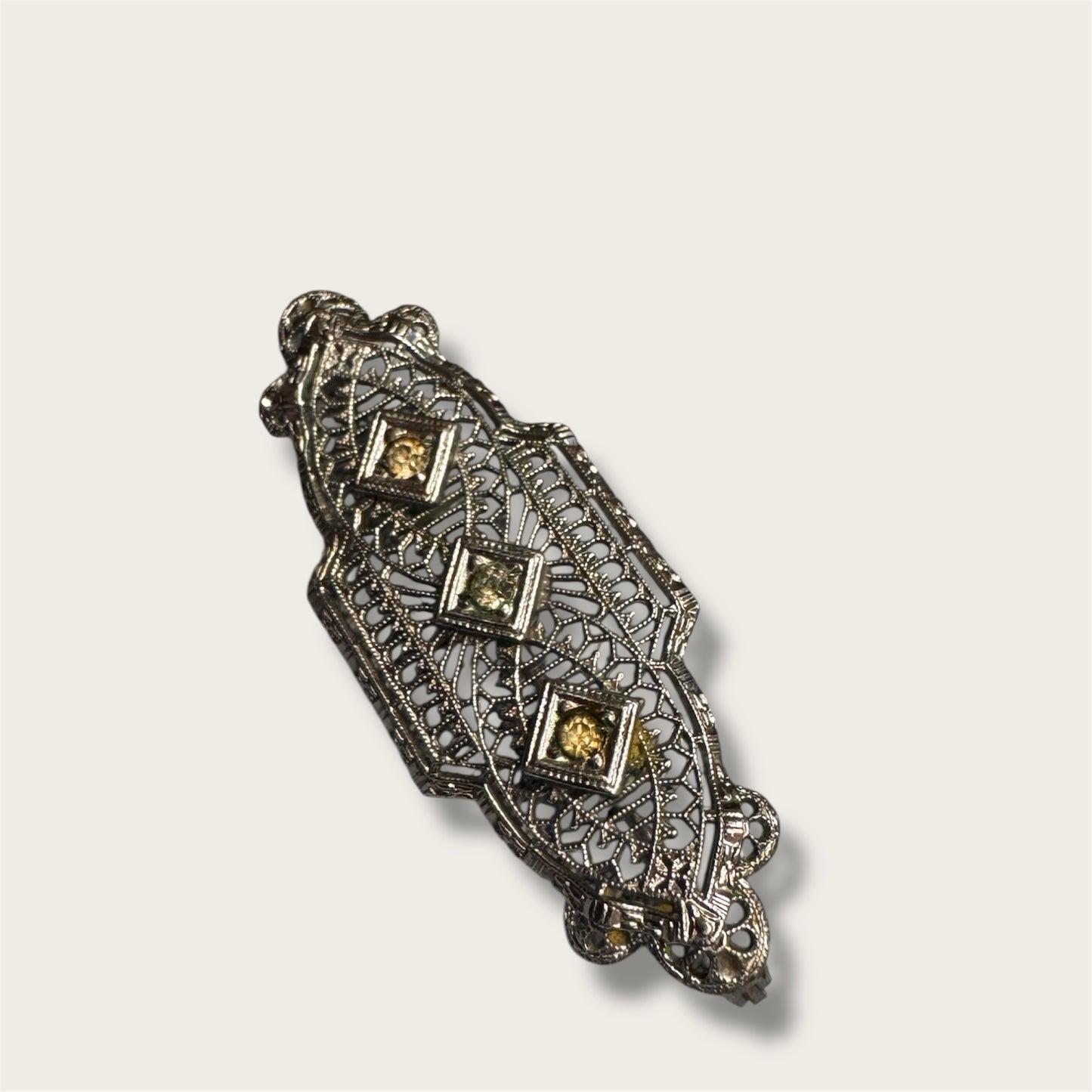 Vintage Silver-Tone Geometric Filigree Brooch with Champagne Rhinestones