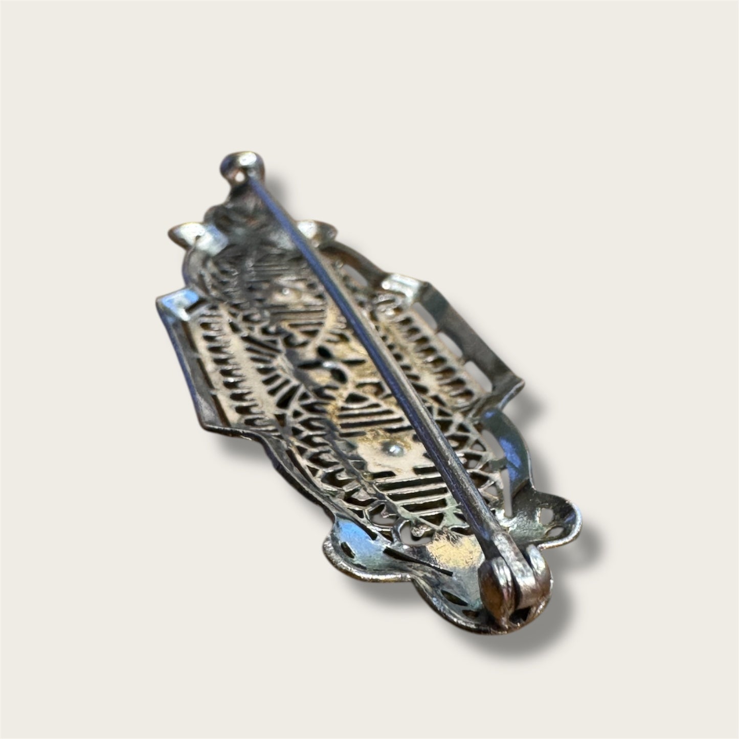 Vintage Silver-Tone Geometric Filigree Brooch with Champagne Rhinestones