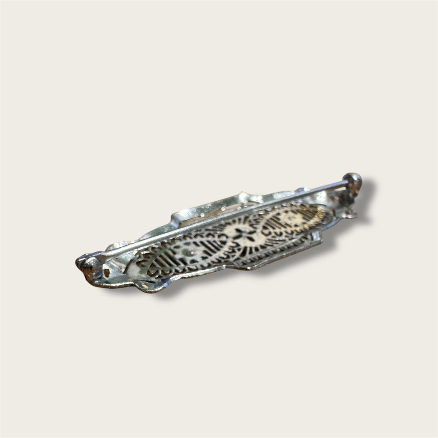 Vintage Silver-Tone Geometric Filigree Brooch with Champagne Rhinestones