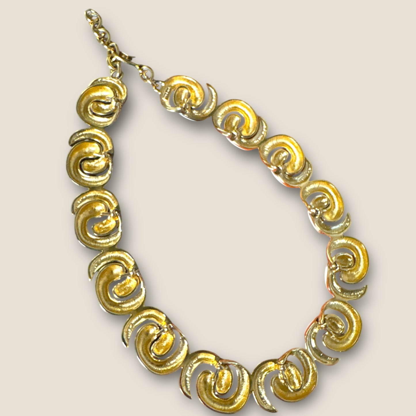 Vintage Monet Cream Enamel Sculptural Swirl Necklace – Gold-Tone Articulated Choker (Signed Monet)